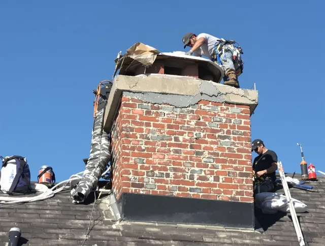 Montclair Chimney Sweep installing a custom chimney crown in Montclair, CA